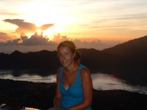 Ruth watching the sunrise at the top of mount batur