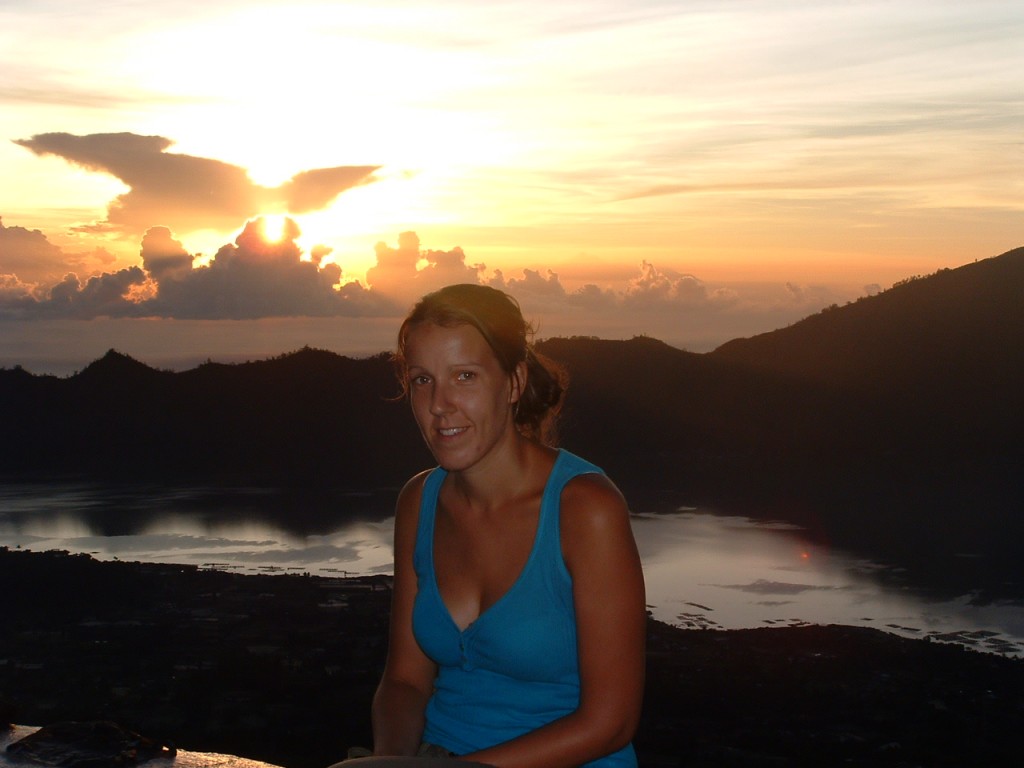 Ruth watching the sunrise at the top of mount batur